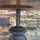 Old adjustable piano stool, blackened wood, metal screws, embroidered seat.
