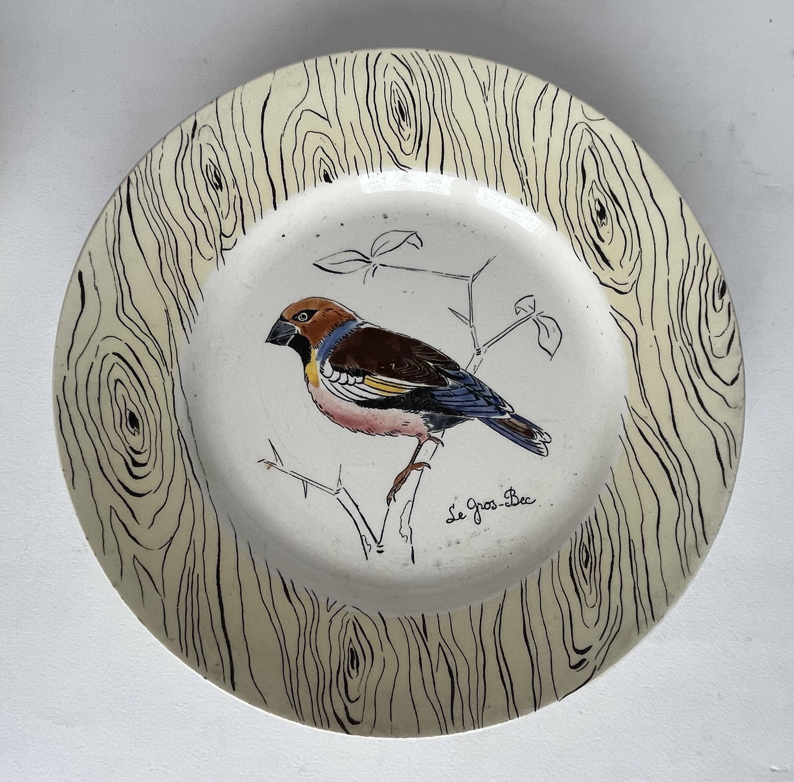 7 antique plates decorated with birds