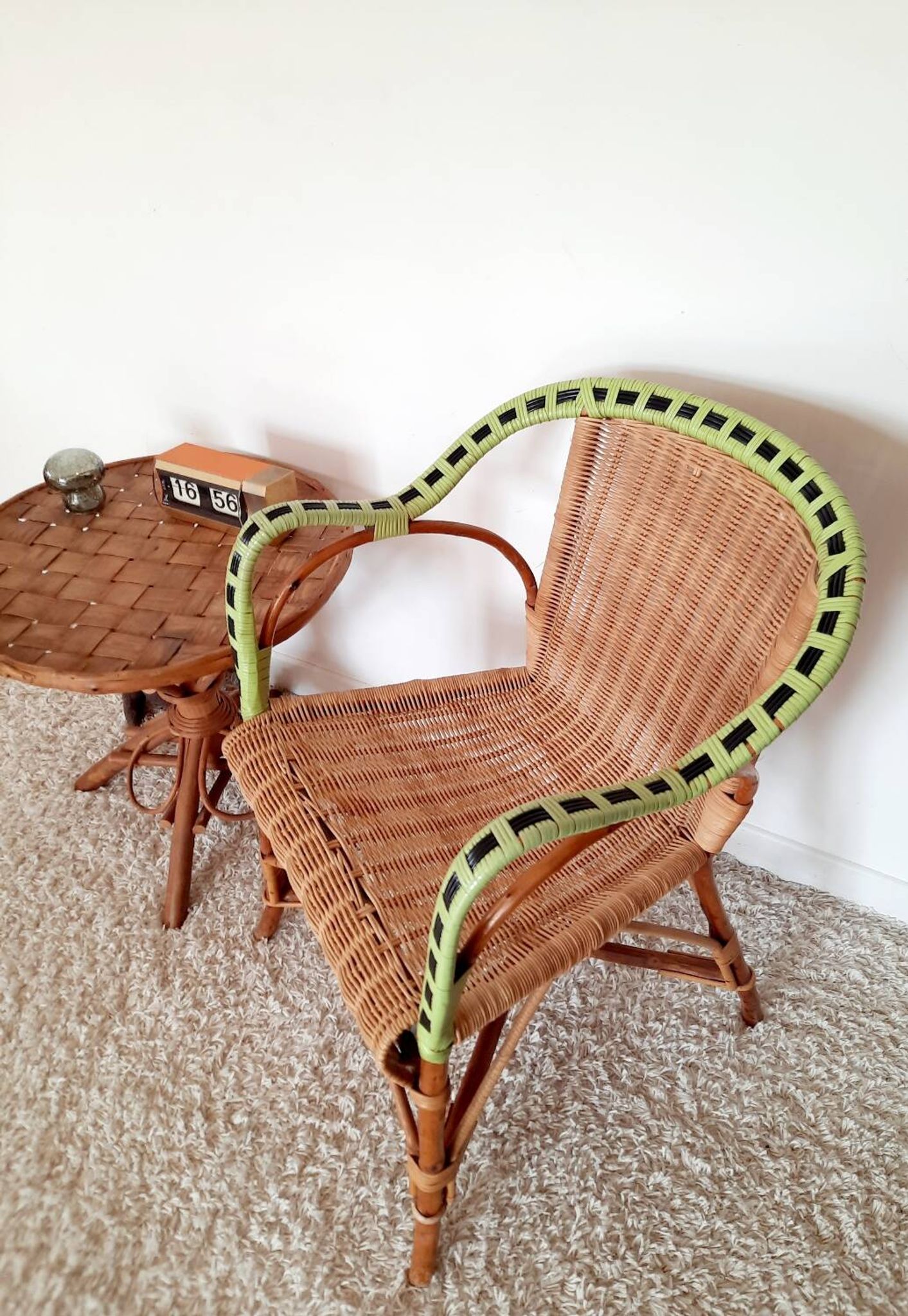 1950s 60s rattan armchair with green apple and black piping.