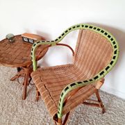 1950s 60s rattan armchair with green apple and black piping.