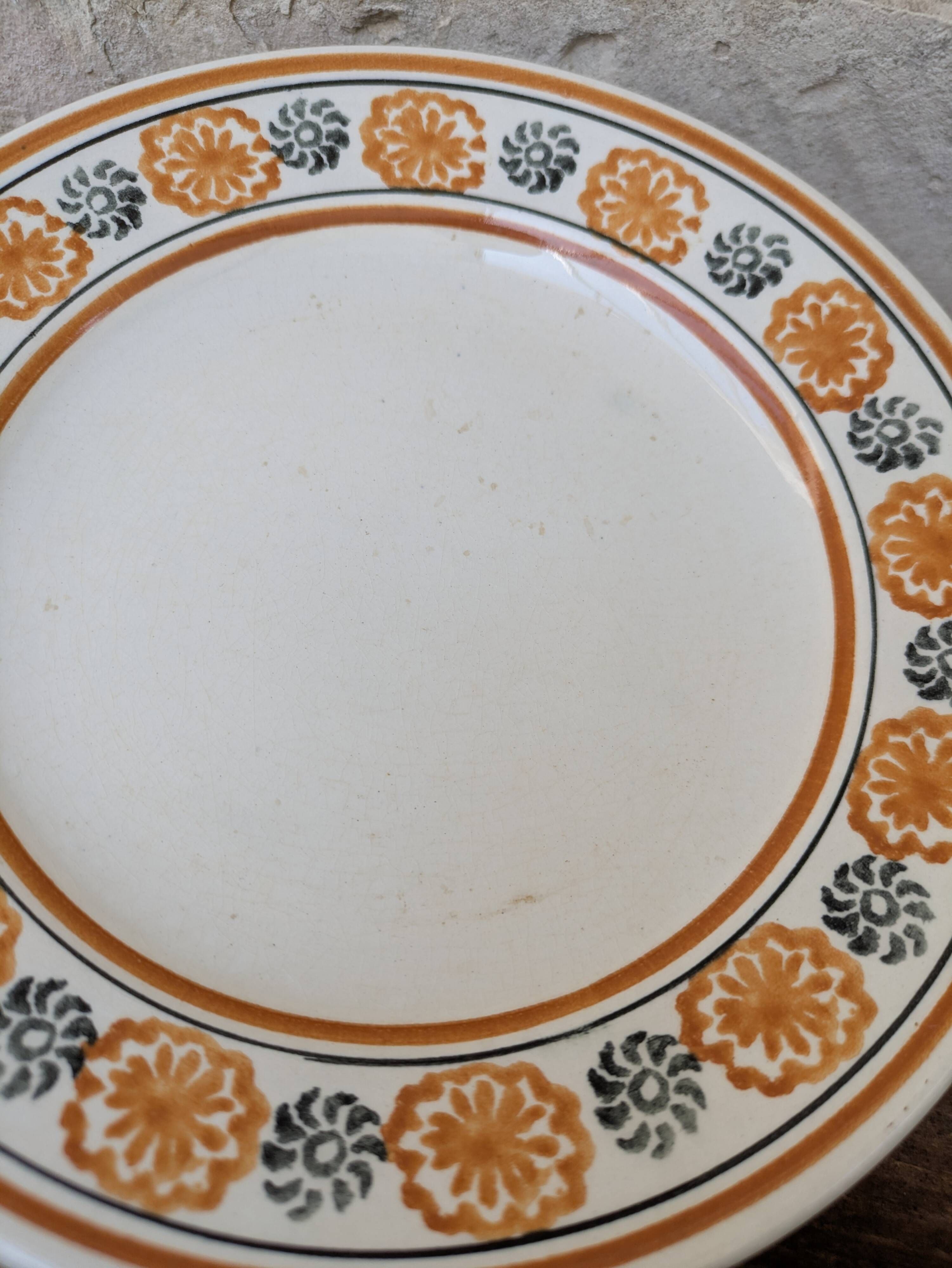 10 dessert plates Saint Amand Amandinoise frilled with orange and black flowers.