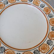 10 dessert plates Saint Amand Amandinoise frilled with orange and black flowers.