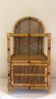 Vintage Spanish rattan and wicker bookshelves with a lower door, 1970s.
