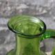 Antique vintage pitcher in green molded glass with floral relief - retro decoration