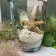 Pinched crystal vase engraved with vintage marine motifs