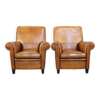 Lot de 2 fauteuils vintage en cuir de mouton couleur cognac
