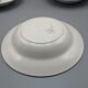 12 assiettes creuses, décor floral et liseré doré - ∅ : 23cm