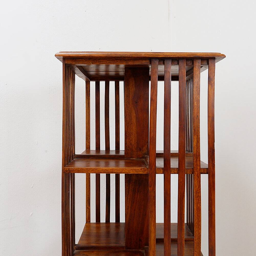 Rotating library on three levels with a central cruciform base.