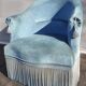 Blue velvet toad chair with fringes and pom poms