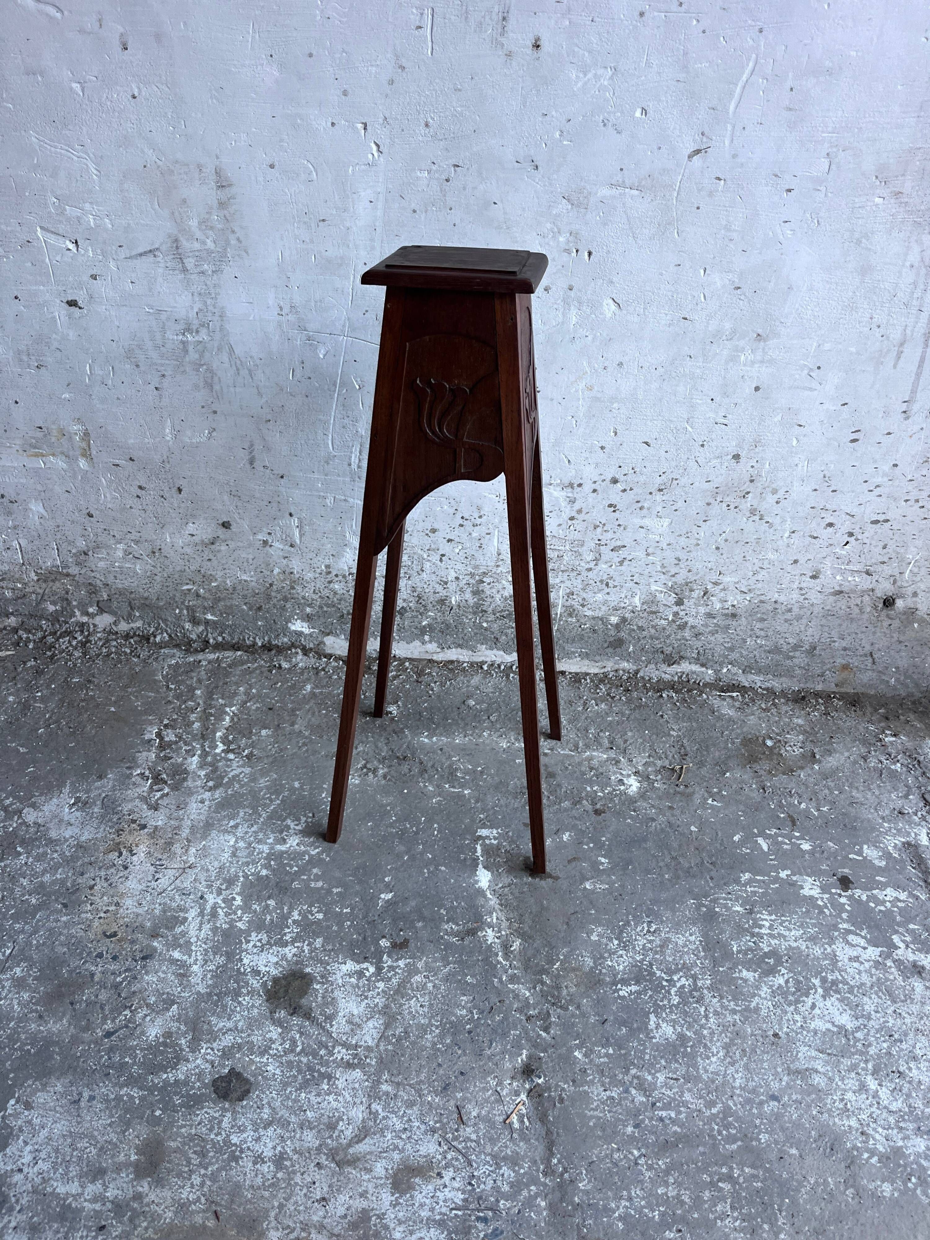 Sculpted wooden plant stand in Art Nouveau style, circa 1910.