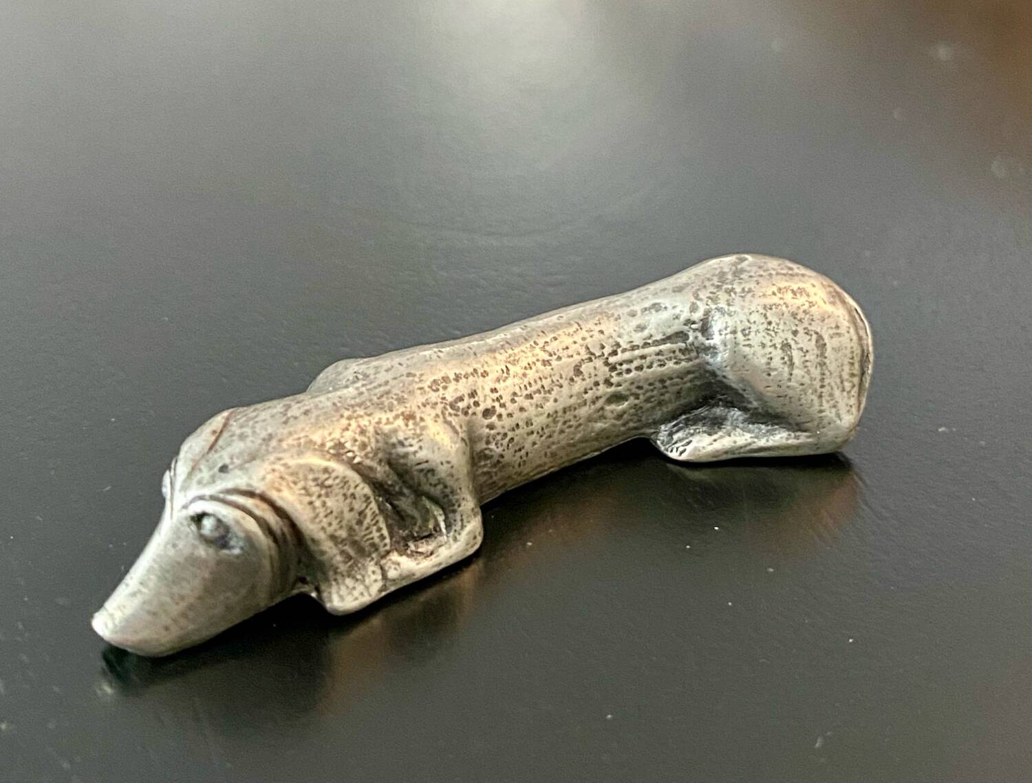 12 old dog-shaped Etains du Manoir knife holders