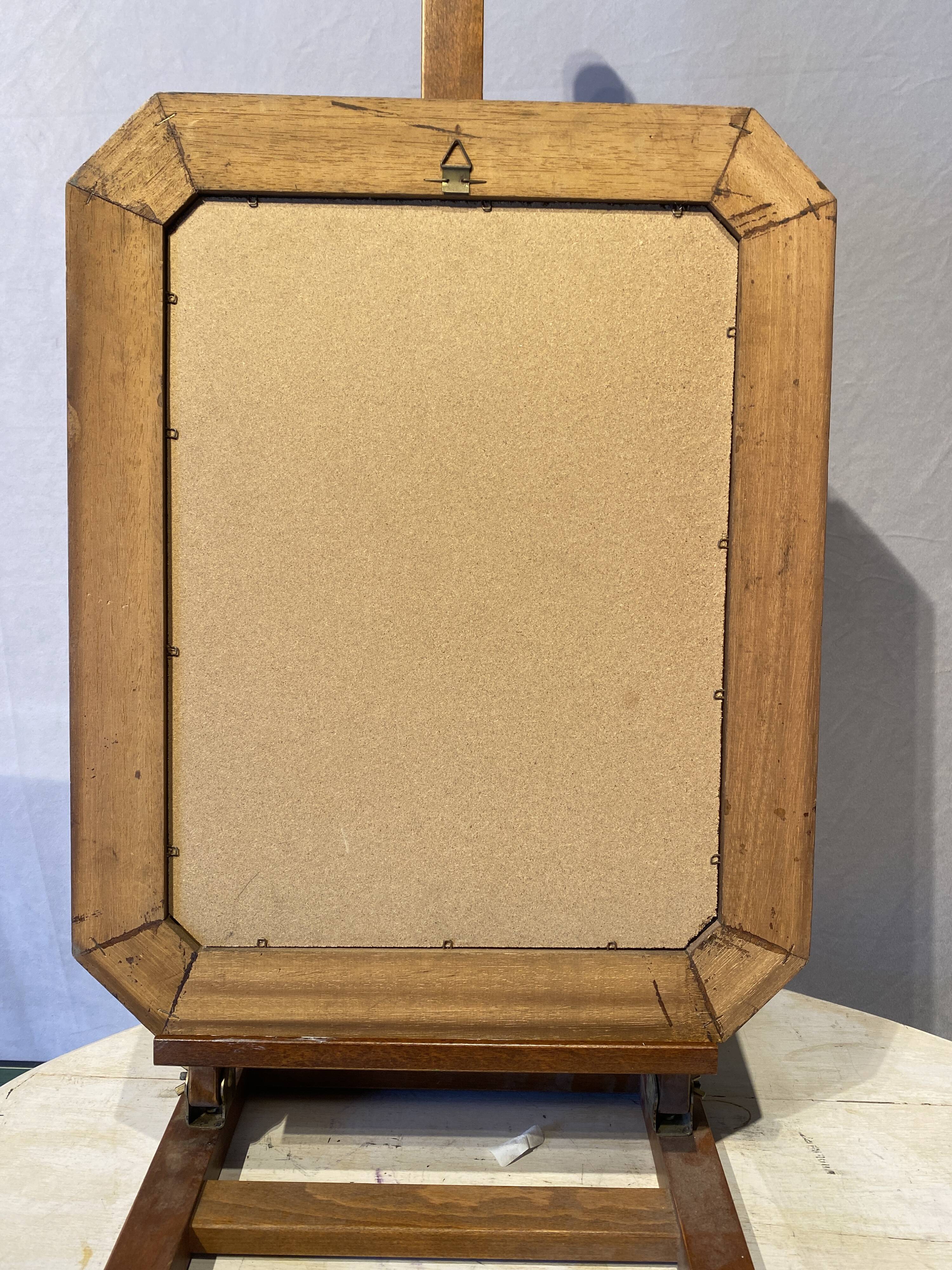 Beveled mirror in its wooden frame