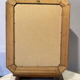 Beveled mirror in its wooden frame