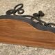Old wrought iron console with a fleur-de-lis design.