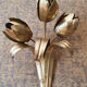 Gold sconces with floral decoration