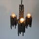 Three-armed suspended lamp in wrought iron, brutalist design, 1960s, Italy.