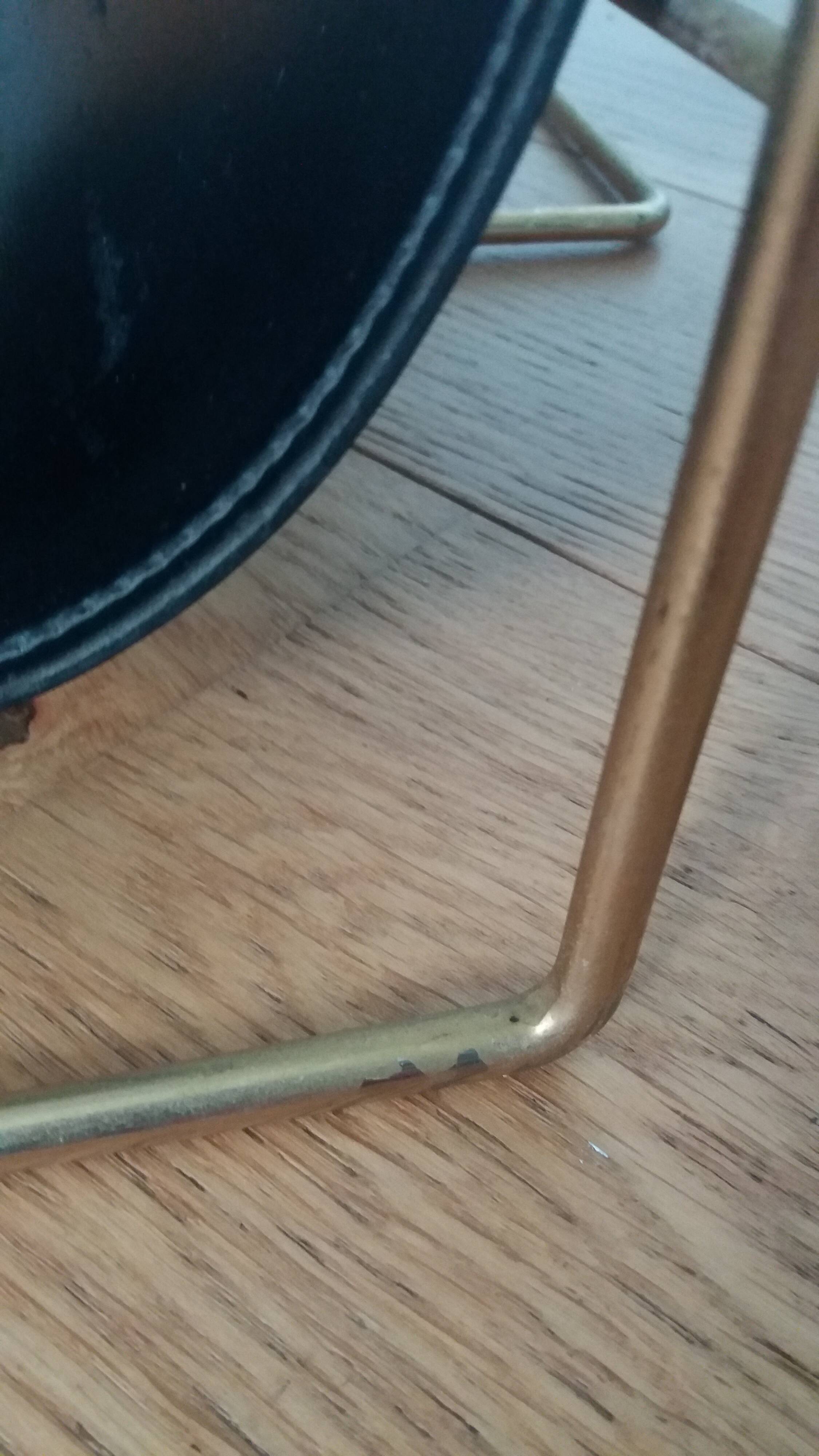 Modernist magazine rack in the style of Jacques Adnet