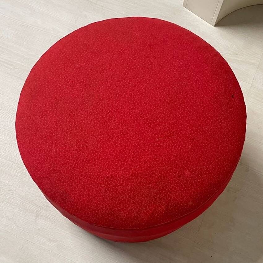 Bathroom toilet with a 70s pouf.