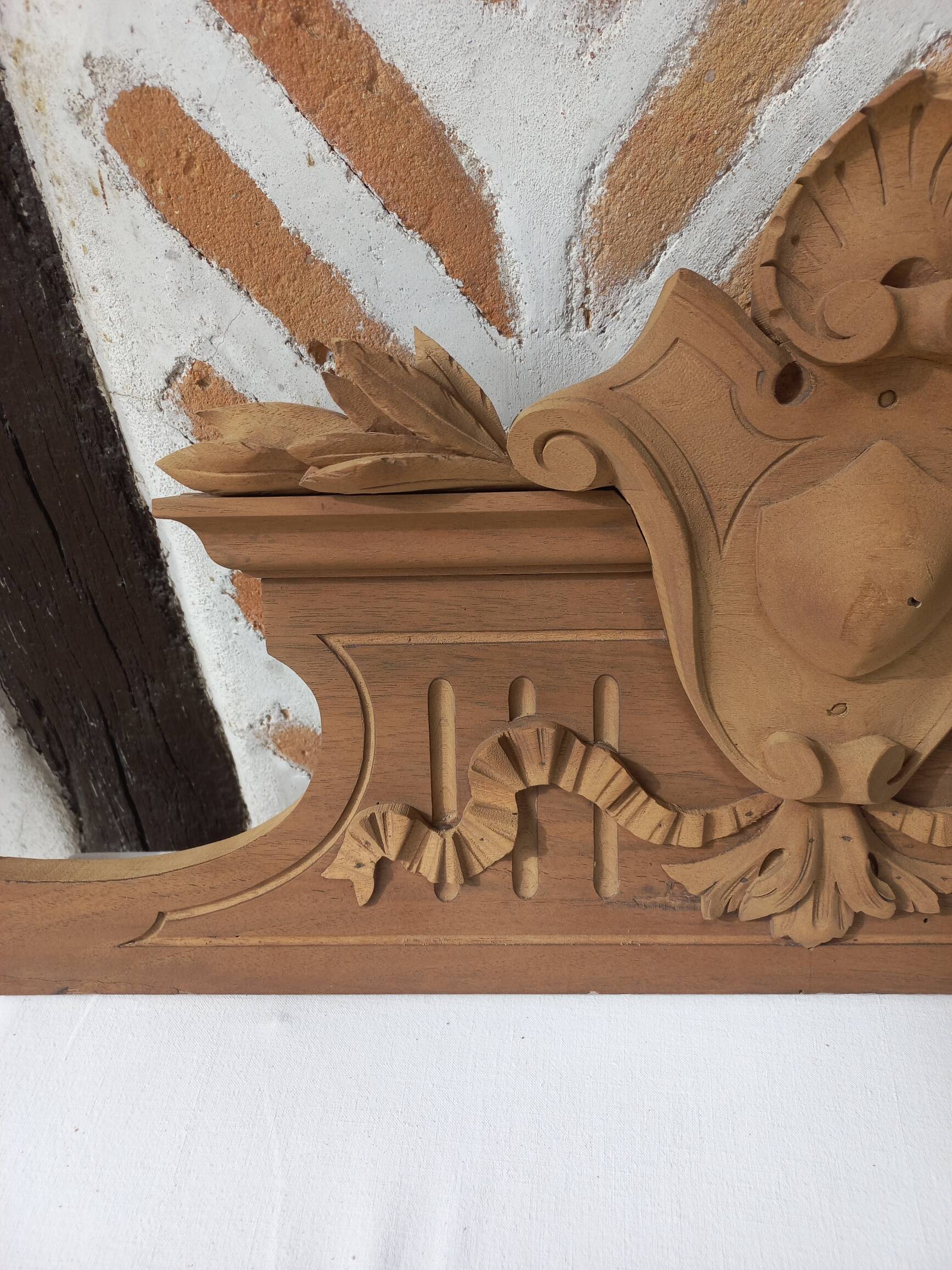 Old sandblasted wooden pediment