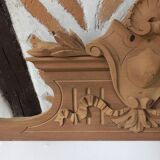 Old sandblasted wooden pediment