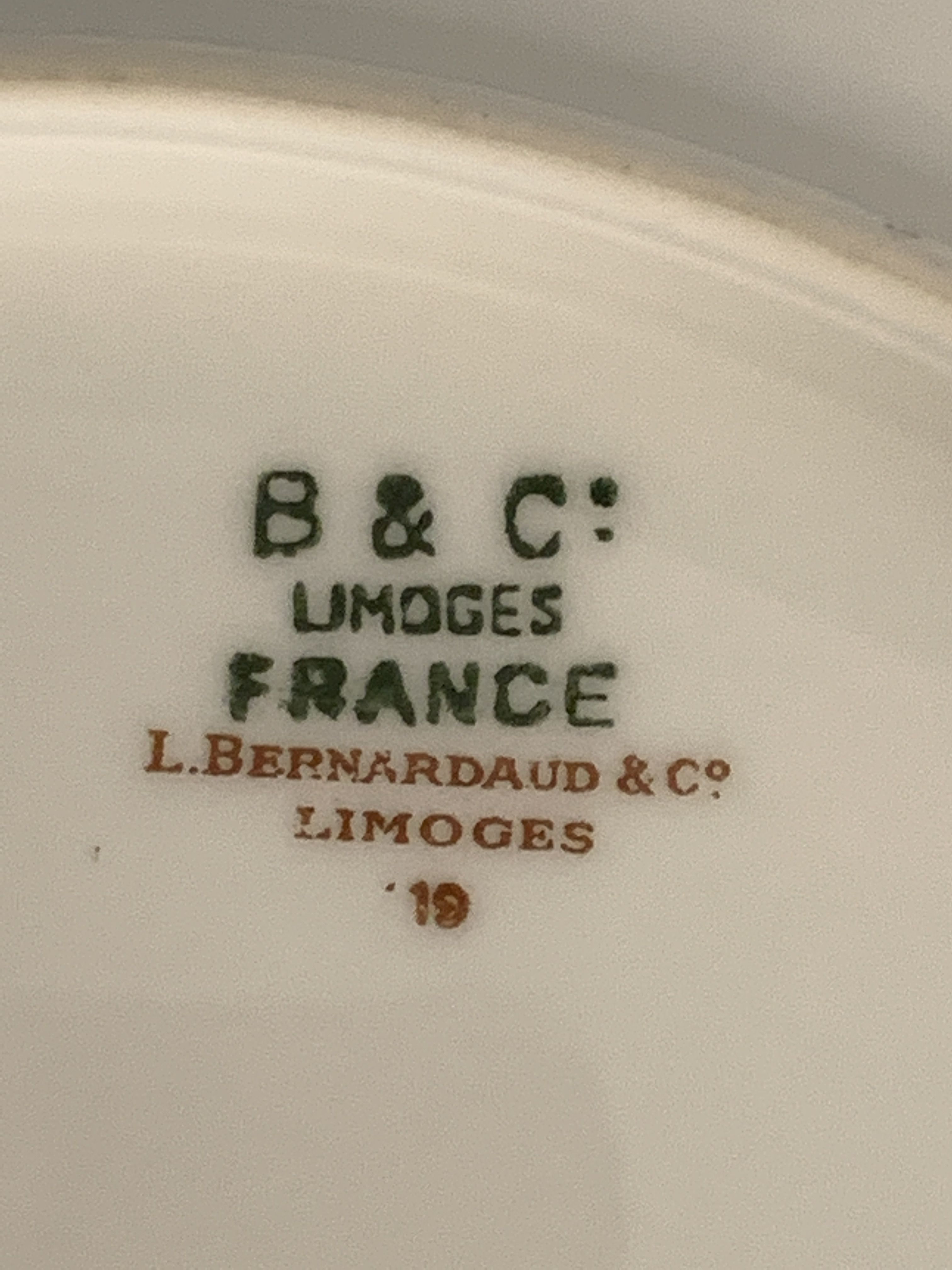 8 flat porcelain plates from Limoges Bernardaud, gilded Greek decoration, twentieth century