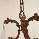 Antique French bronze chandelier with 6 lights and matching crystals.