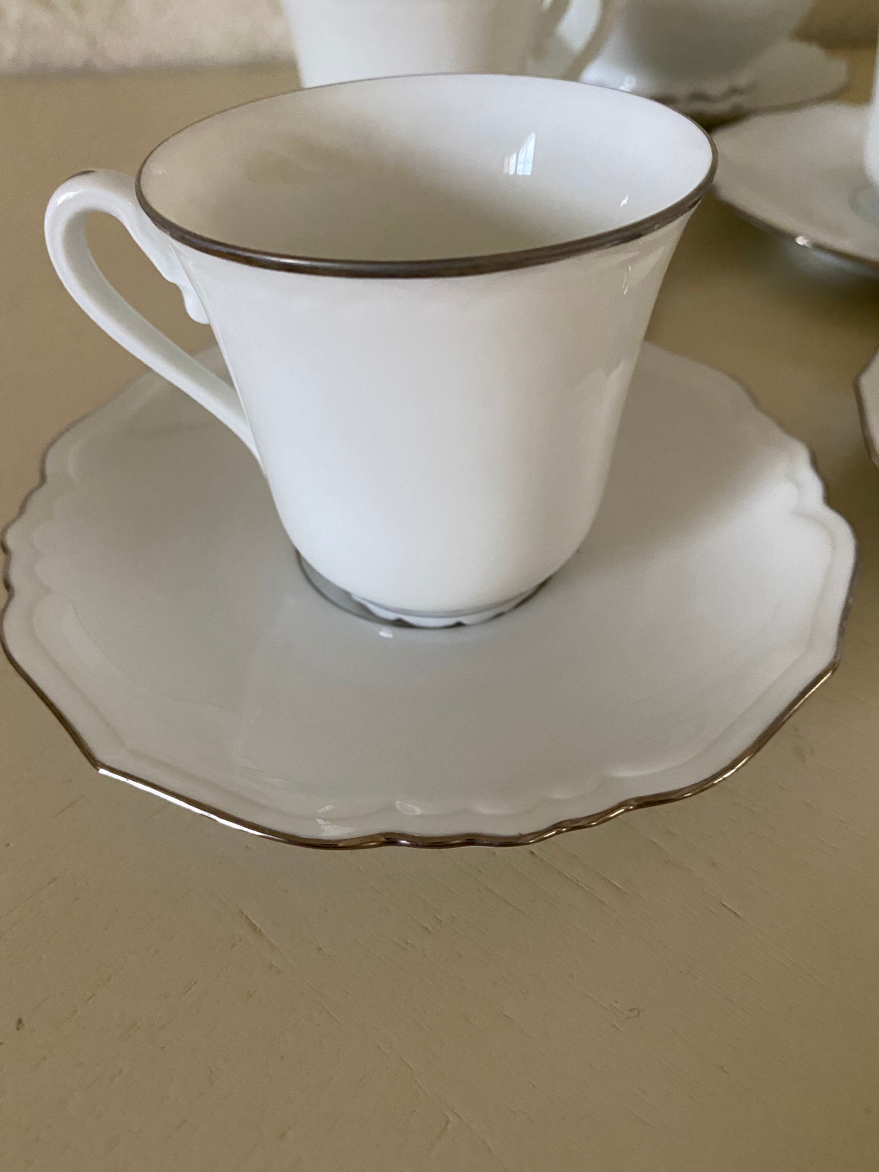 Cups under cups milk pot and porcelain sugar from limages