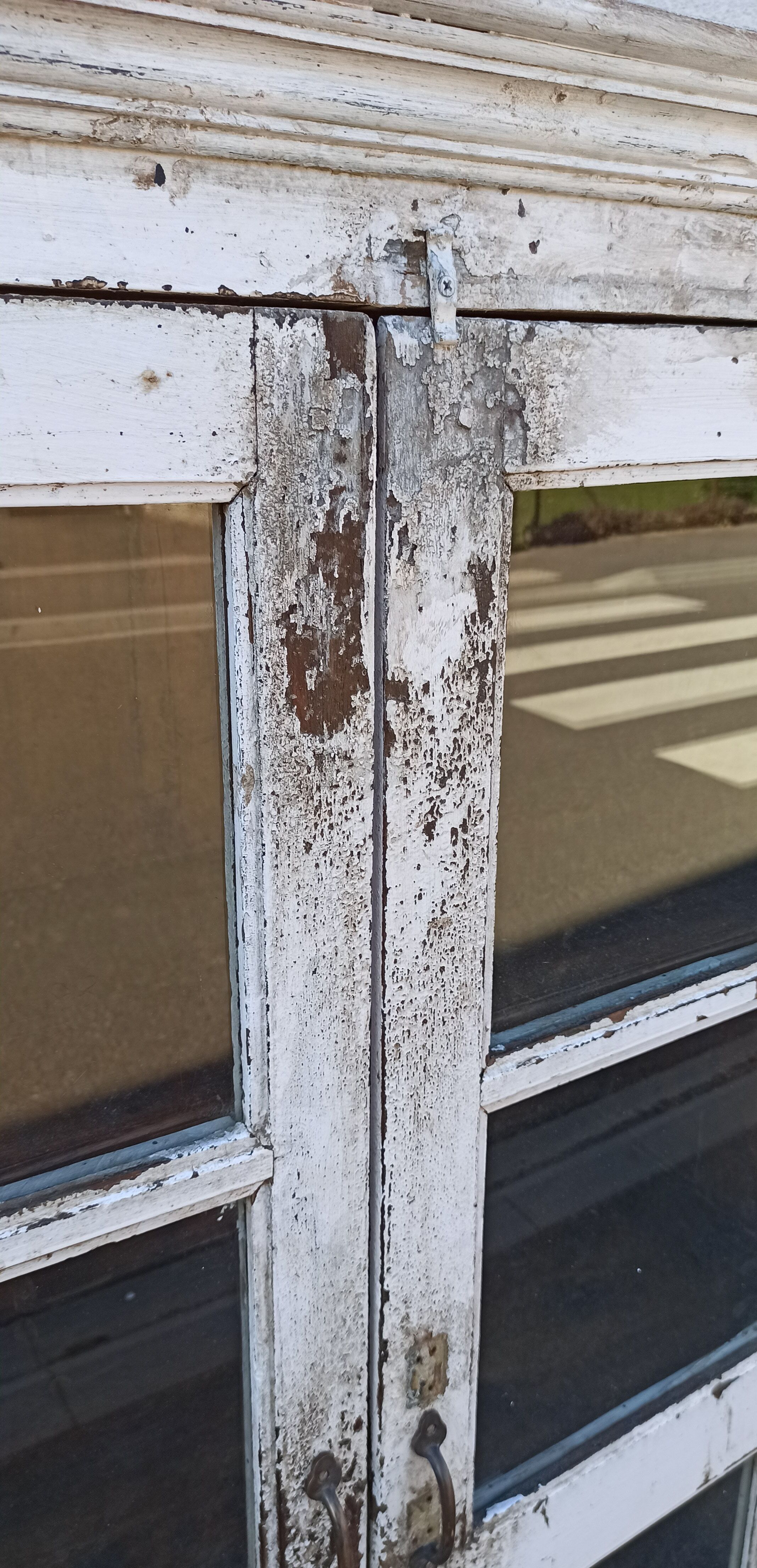 White wooden antique glazed wardrobe