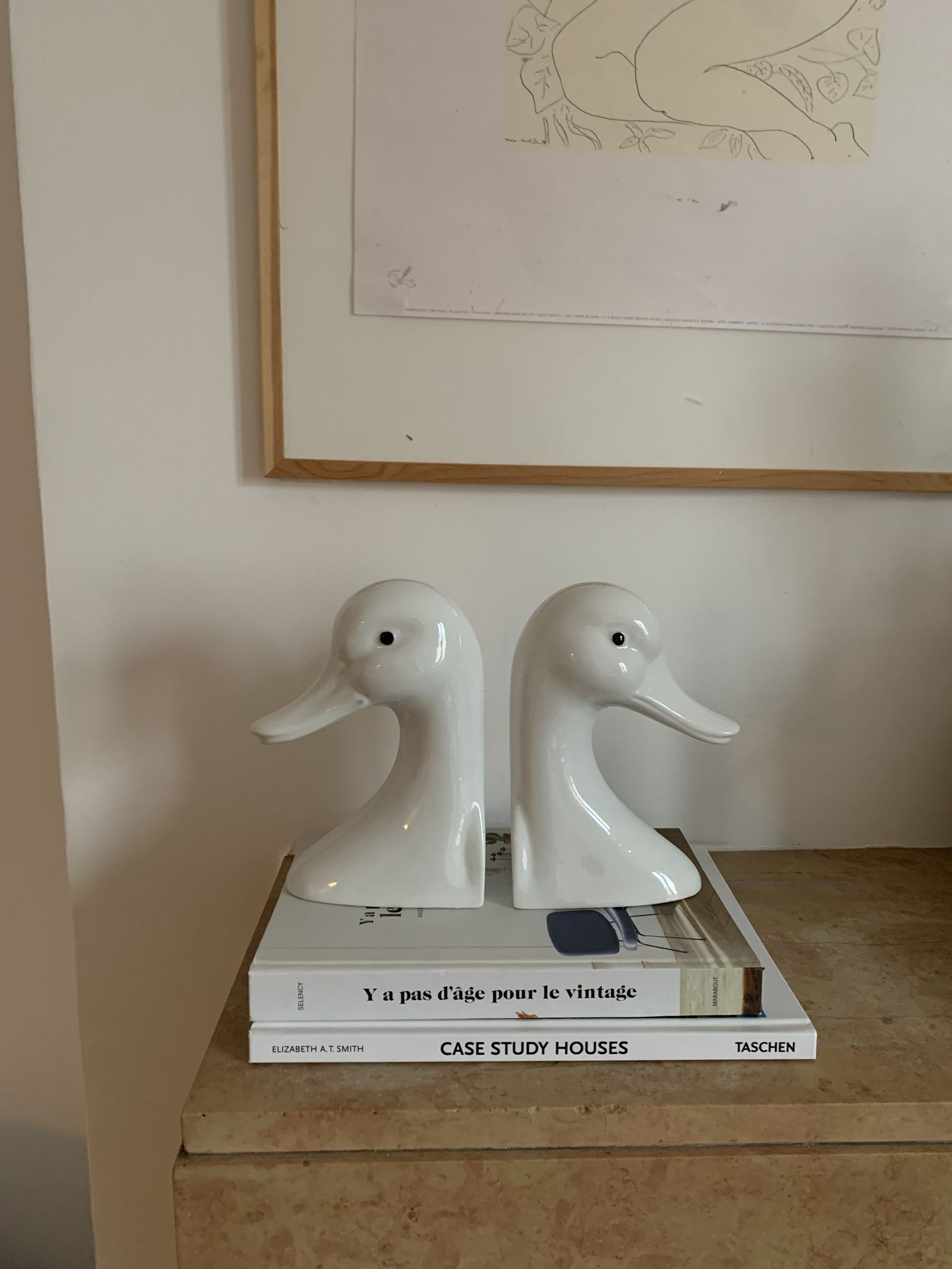 Vintage bookends in the shape of a goose or ceramic duck