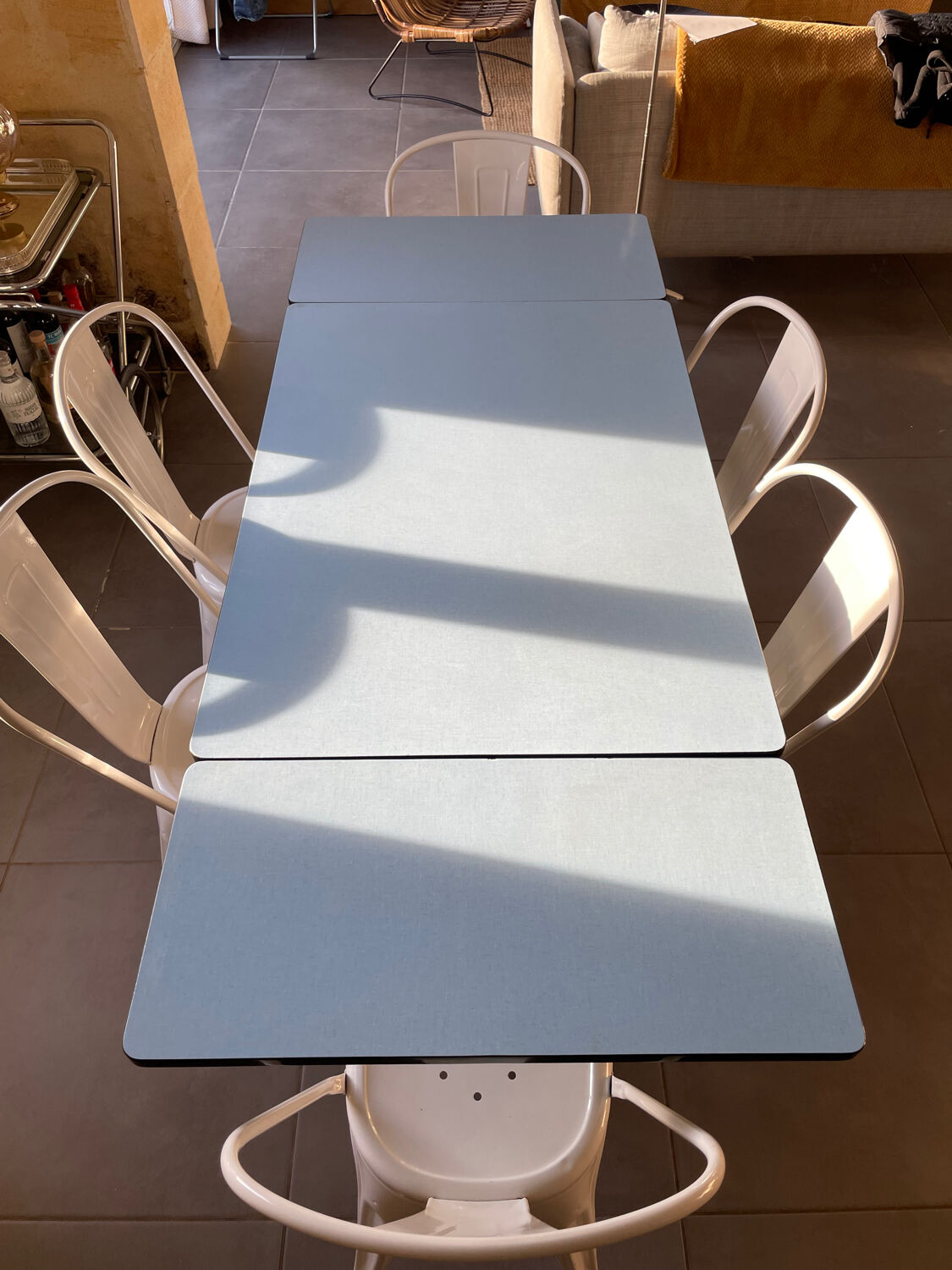 Blue Formica table for 4 to 6 people