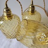 Trio of yellow glass pendant lights