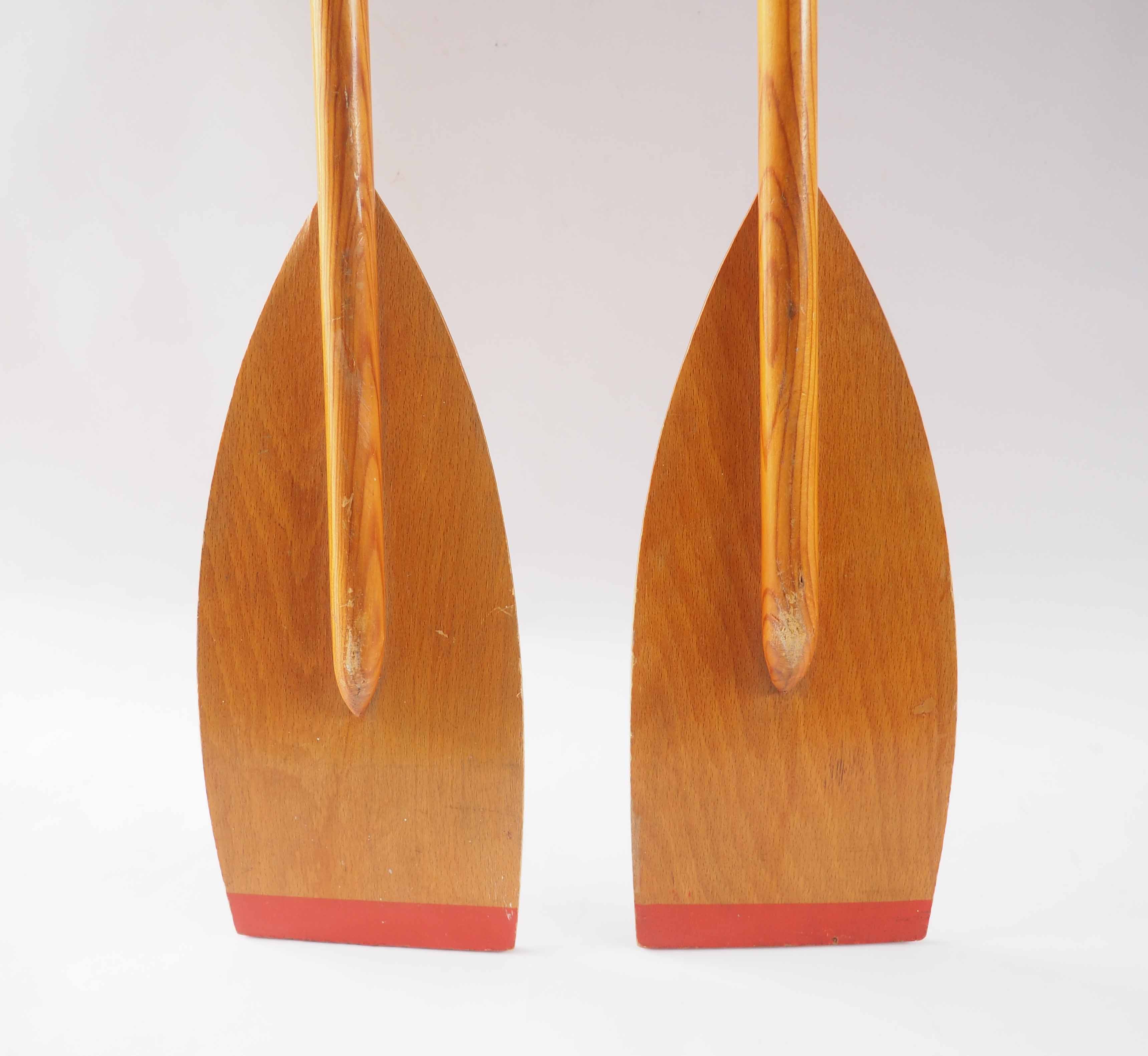 Pair of old wooden oars