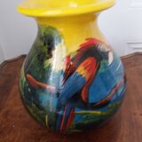 Mexican popular art vase decorated with parrots and toucans.