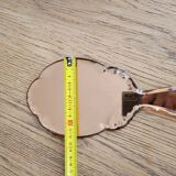 Mirror facing beveled hand
