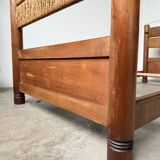 Brutalist style bed with chain and straw