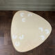 Tripod coffee table with floral design from the 1950s in brass metal and decorative top.