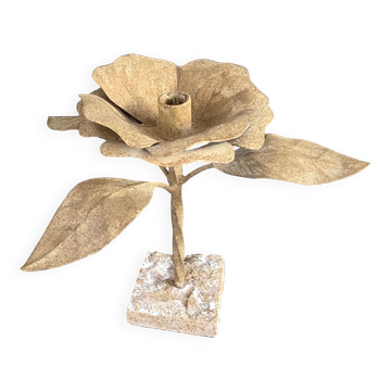 Painted metal flower candlestick with a stone base.