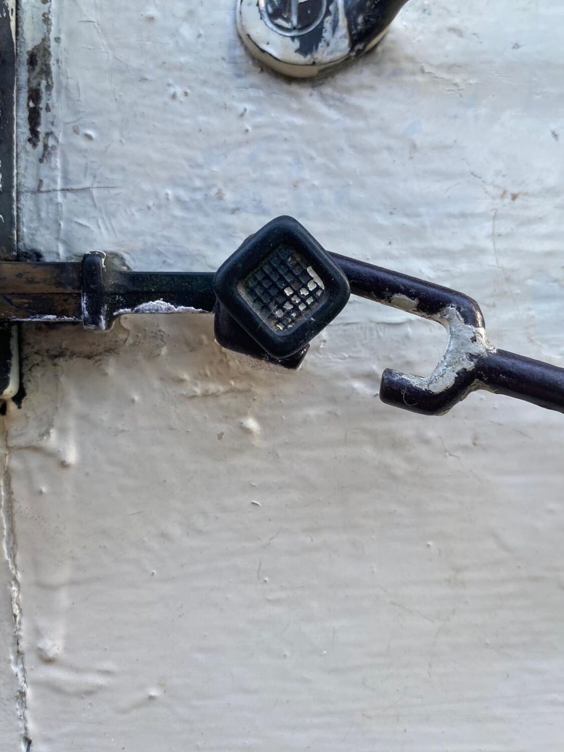 Entrance door in solid oak, cast iron grille, 1930s