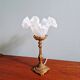 Table lamp in gilded bronze with opalescent glass shade, early 20th century.