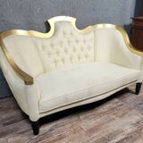 Banquette vintage à dossier capitonné, revêtu d’un tissu ivoire