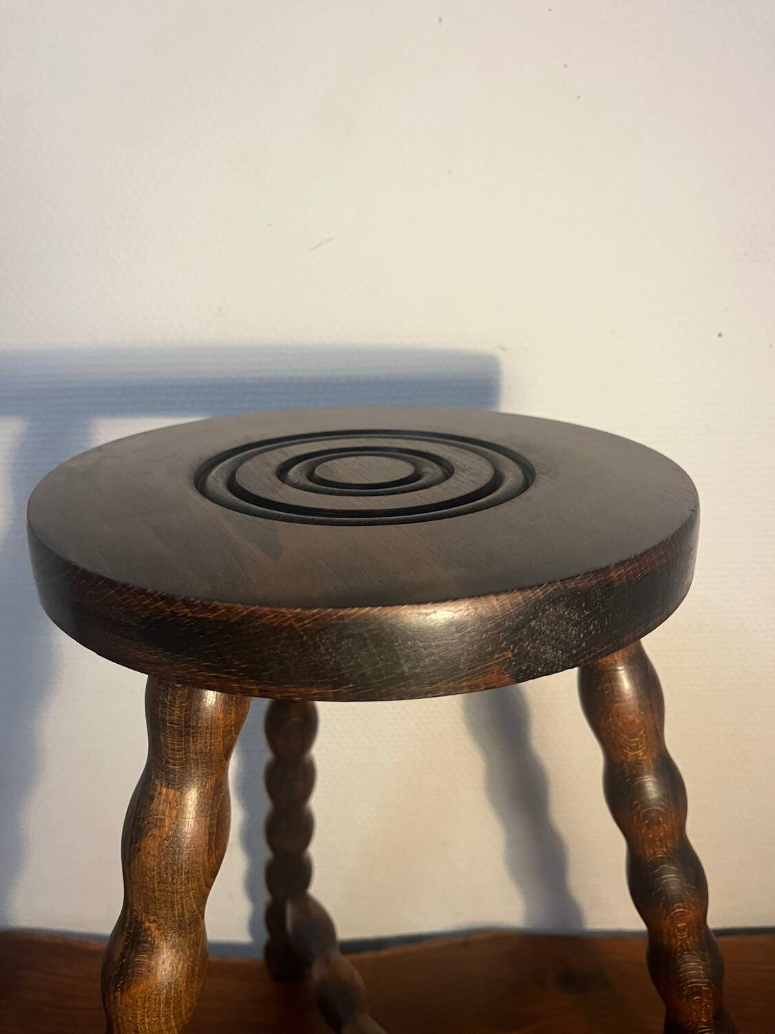 Round tripod stool with turned wooden legs