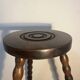 Round tripod stool with turned wooden legs