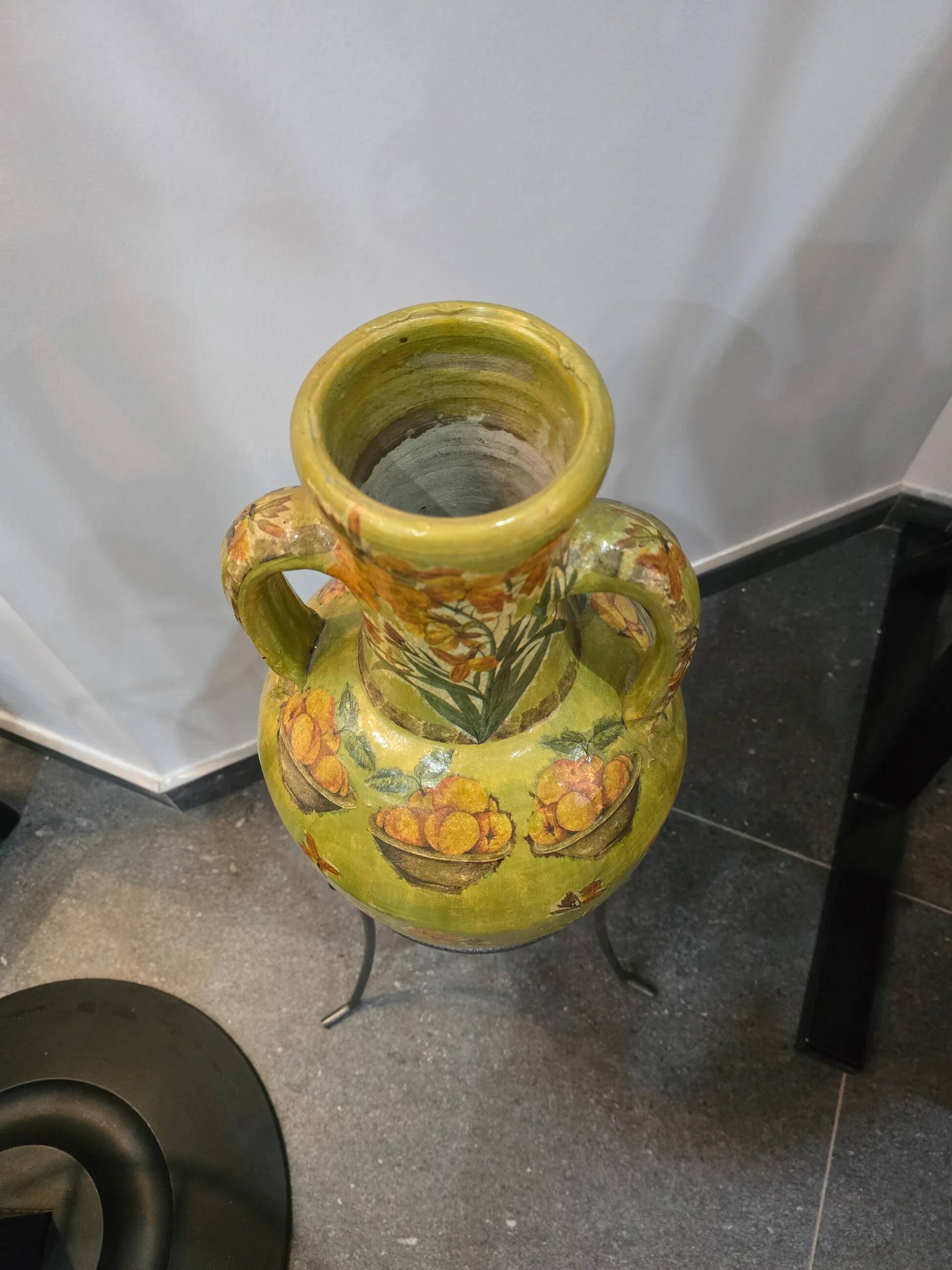 Large decorative vase with handles – painted floral design – on a metal stand