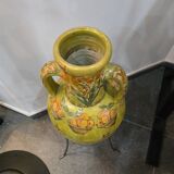 Large decorative vase with handles – painted floral design – on a metal stand