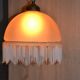 Lustrous suspension in glass paste, glass and ceramic pendants.