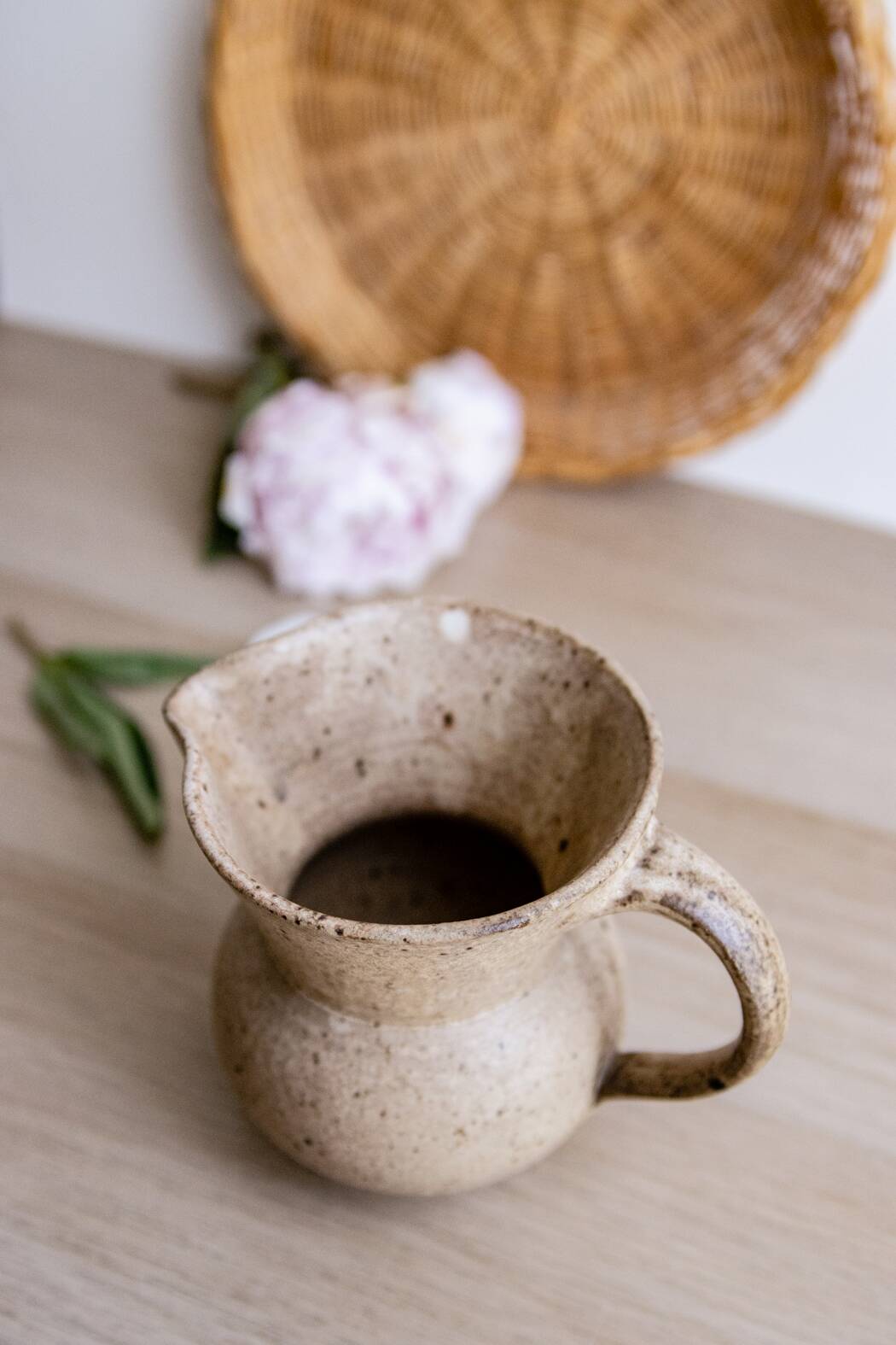 Small pitcher in old speckled stoneware