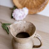 Small pitcher in old speckled stoneware