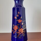 Vase bleu fleurs oranges et vertes