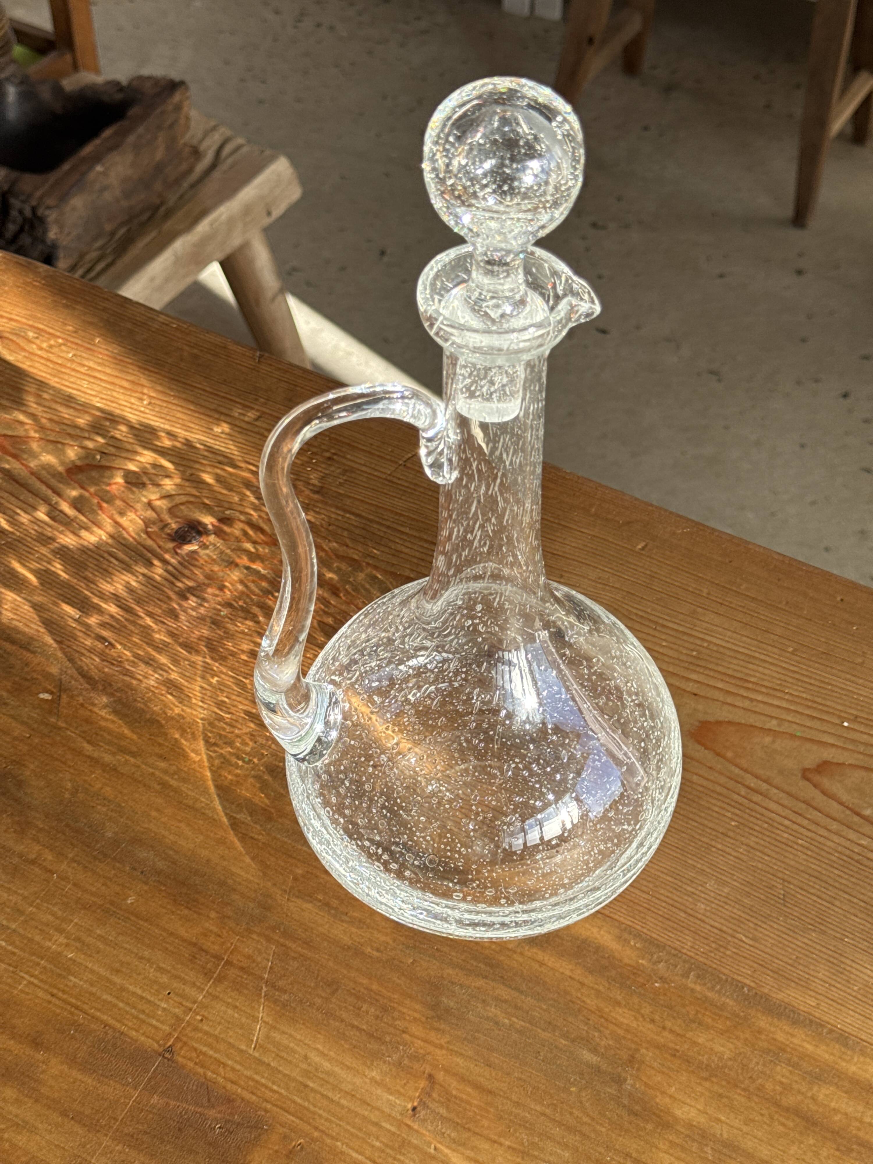 Large transparent glass carafe with a Biot stopper H32 D14.5