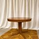 Round table with central base from the 1960s by Baumann.